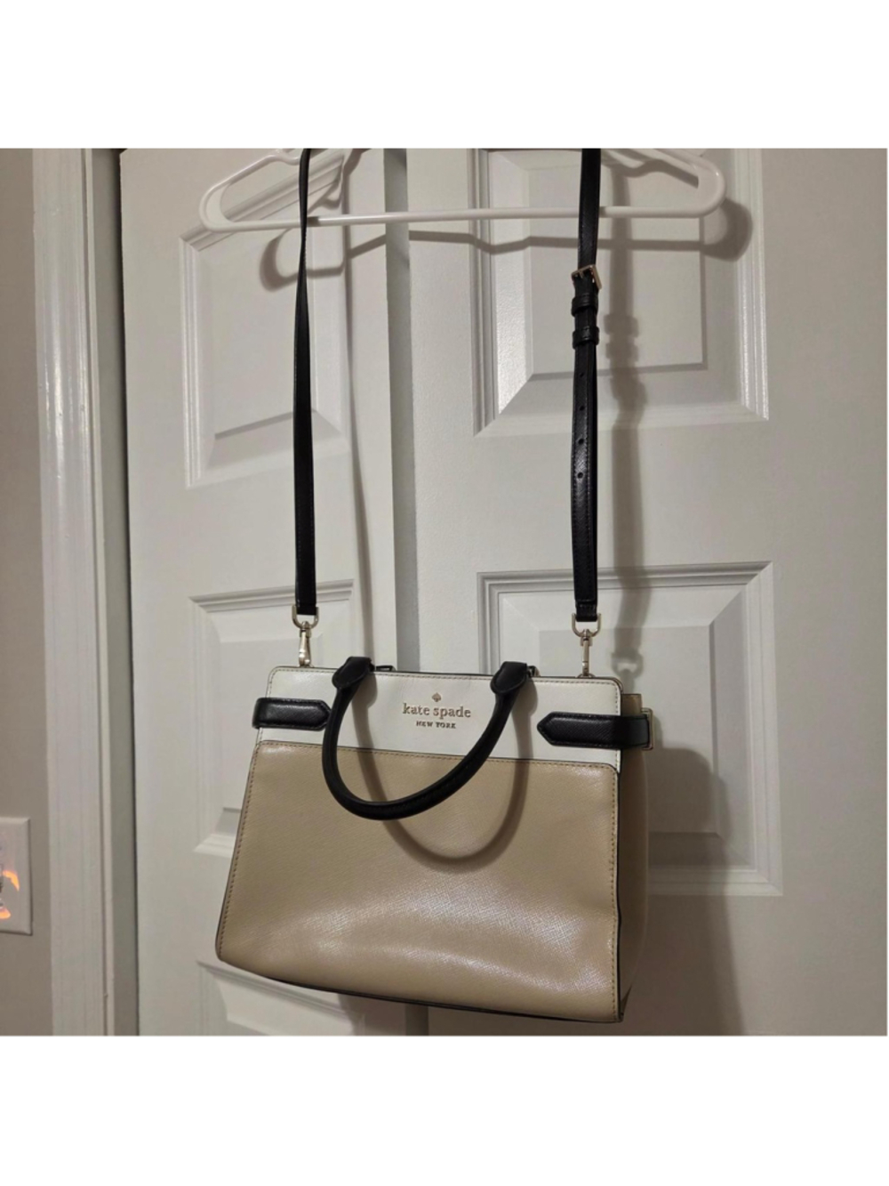 Kate Spade New York cream & white leather satchel crossbody with black trim, has